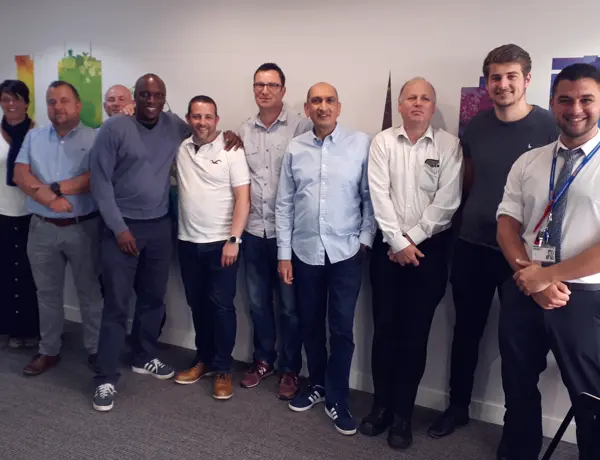 Daisy Communications staff looking at the camera posing for a photo