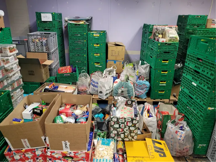 Inside Blackburn food bank showing donations