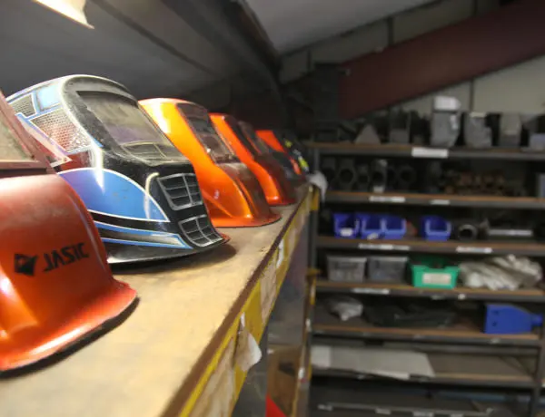 Close up of welding equipment arranged on shelving