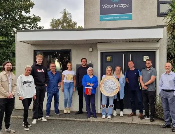 Woodscape staff stood outside their office building