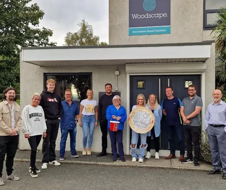 Woodscape staff members, stood outside their office
