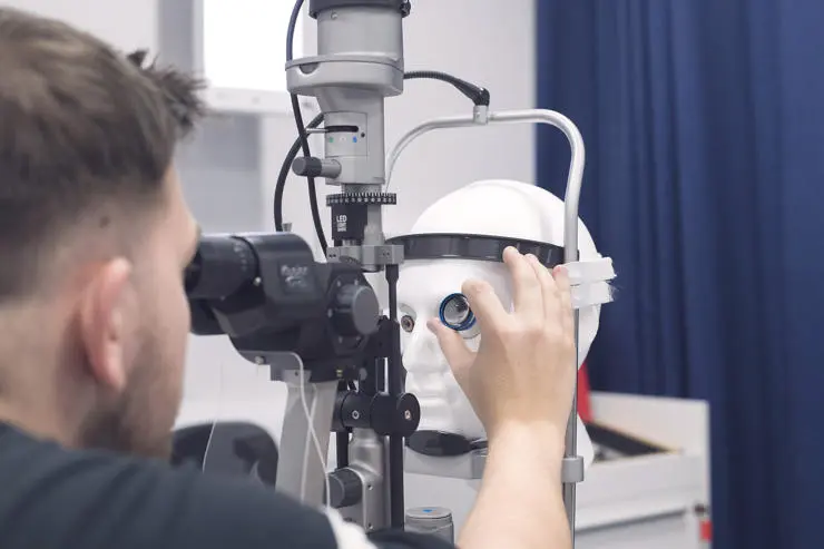 Person operating an optical machine